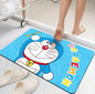 Cartoon character rug with 'Doraemon' on a light-colored floor.